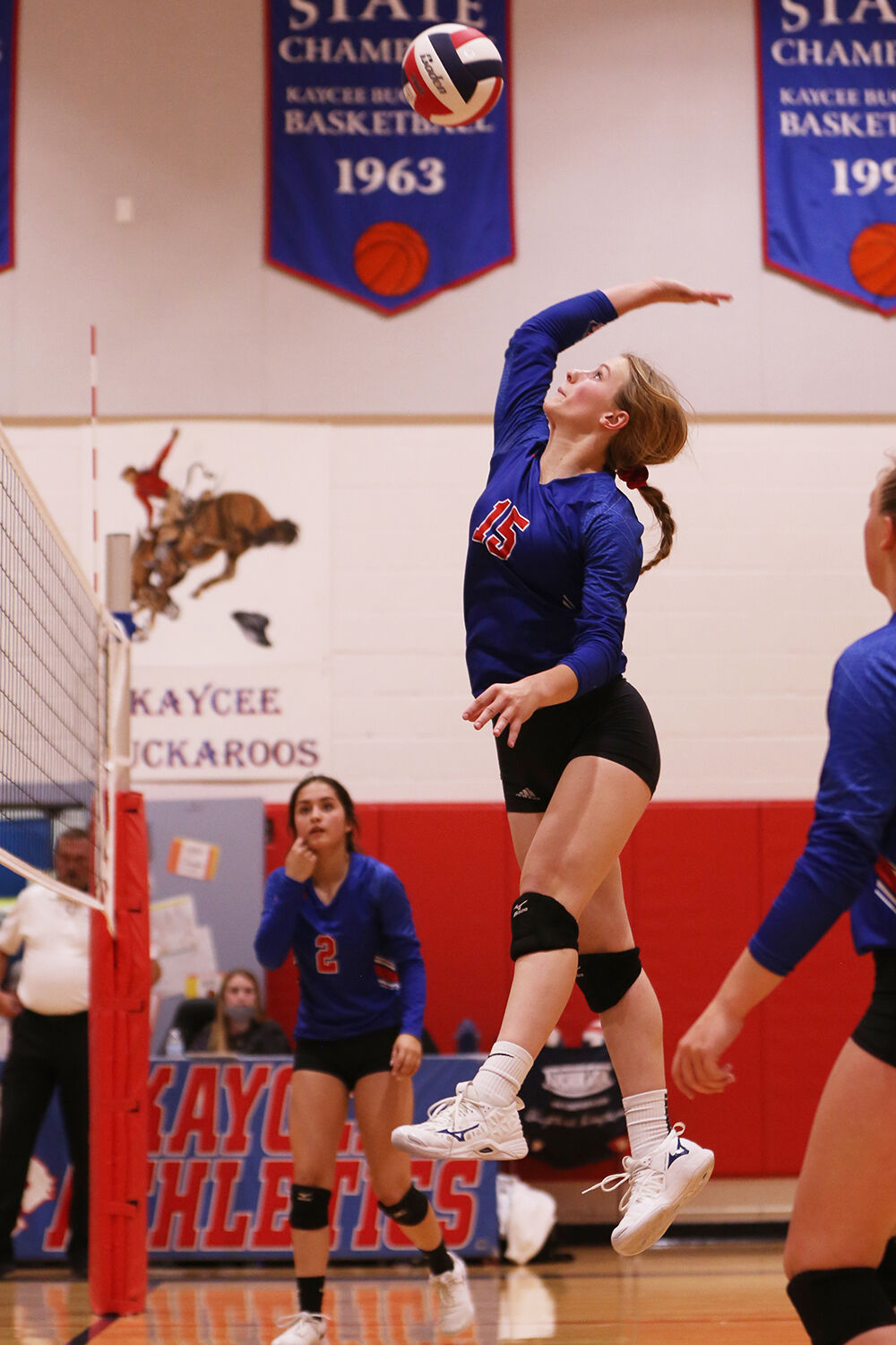 Tinley Pierson makes a hit toward the left edge of the court